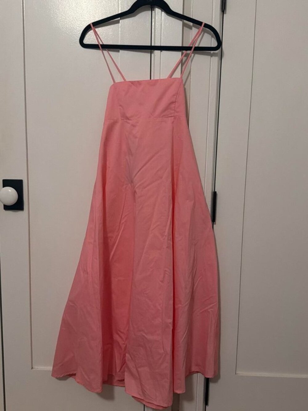 Pink midi dress with spaghetti straps and flowy fabric